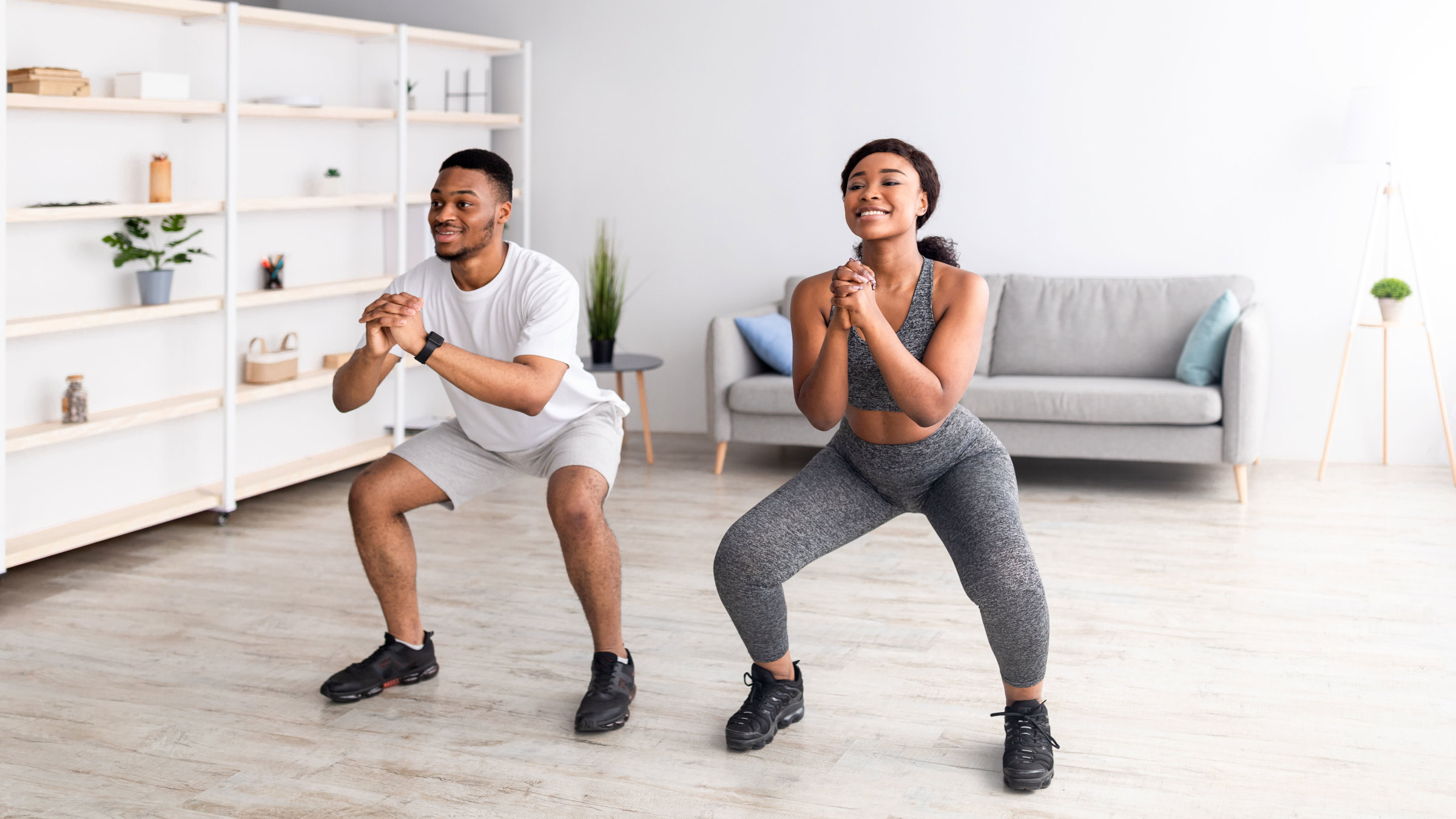 Happy Motion Shop -Happy Motion Shop couple doing squat exercise at home 1322852339